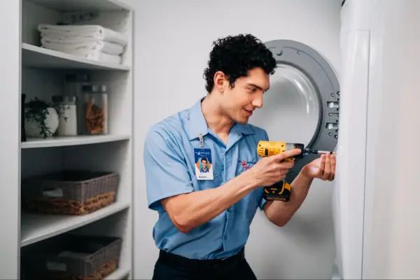 Mr. Appliance working on top load dryer